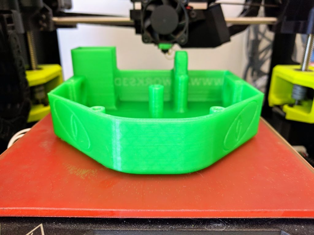 3d print of a combat robot chassis in translucent green INOVA-1800 filament and cubic infill.
